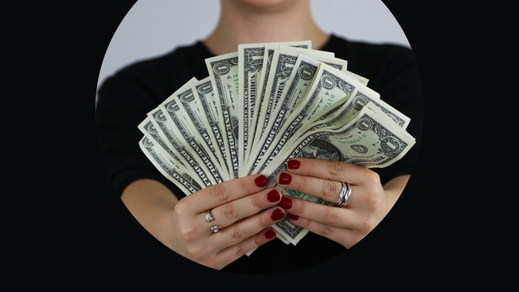 Image of hands holding dollar notes